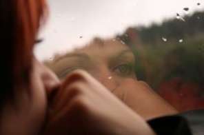 Girl's reflection in window