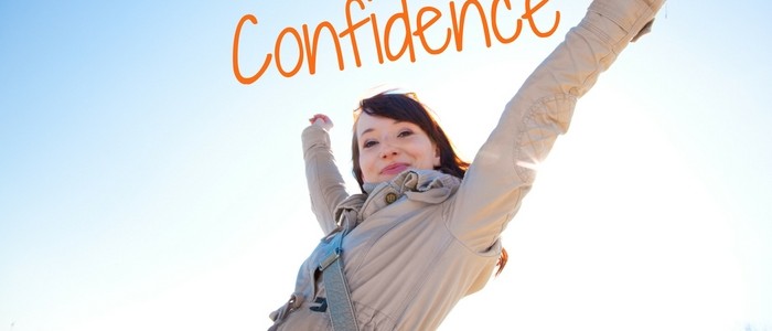 Girl with arms in air showing confidence